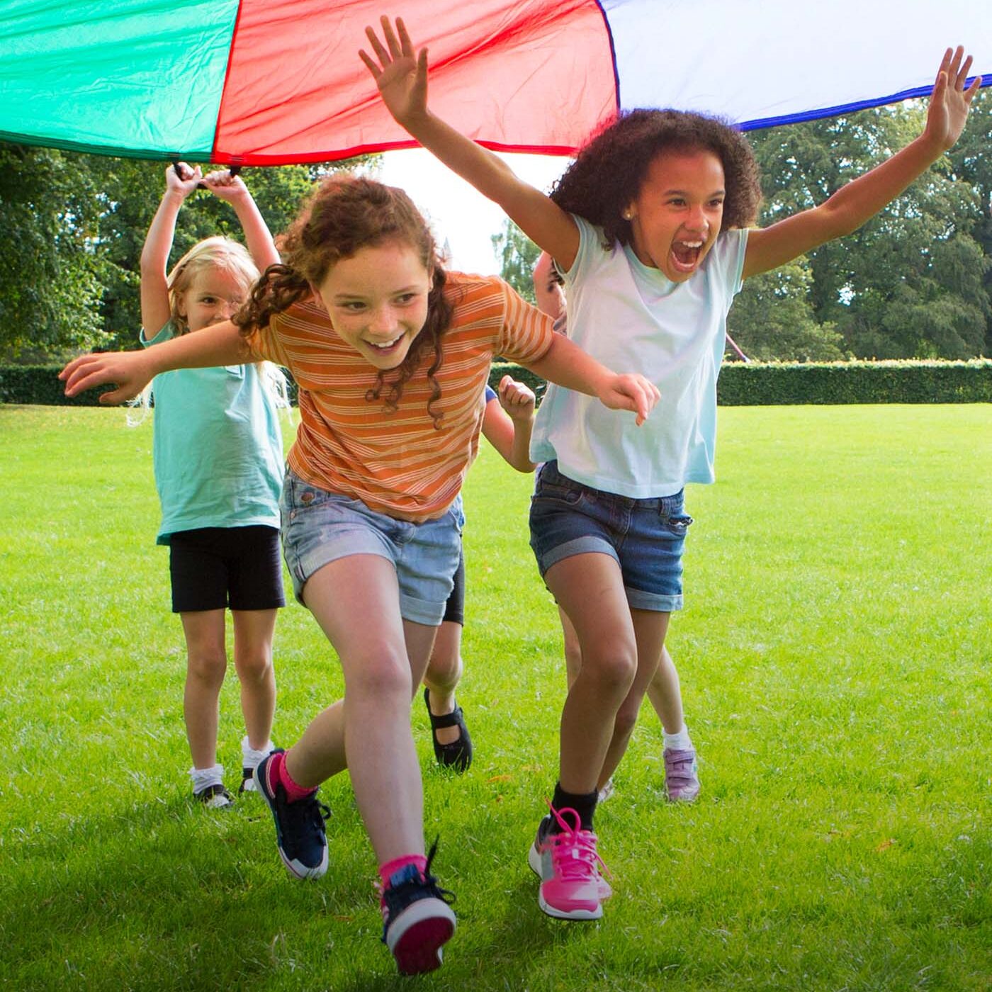 children running under fun color canopy-v2